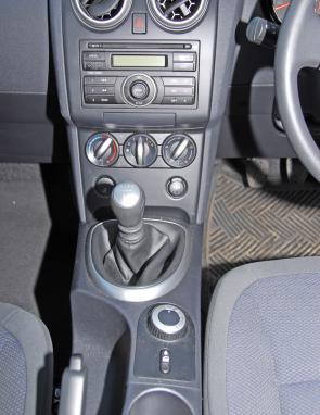 A console-mounted switch governs traction modes in the Dualis, as front wheel drive is standard. 
